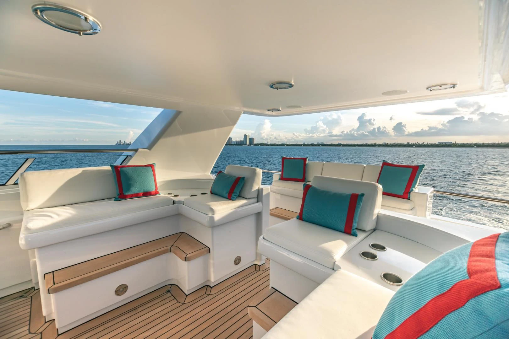 a boat with a view of the ocean and the land below aboard ACTA Yacht for Charter