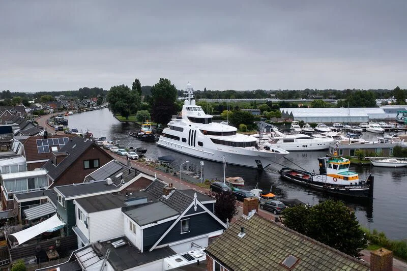 a group of boats are parked in a harbor aboard ACTA Yacht for Charter
