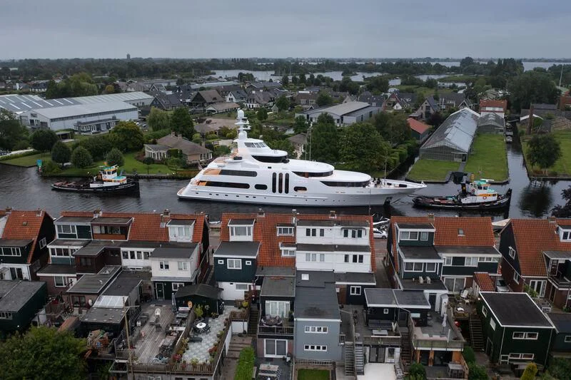 a large ship in a harbor aboard ACTA Yacht for Charter