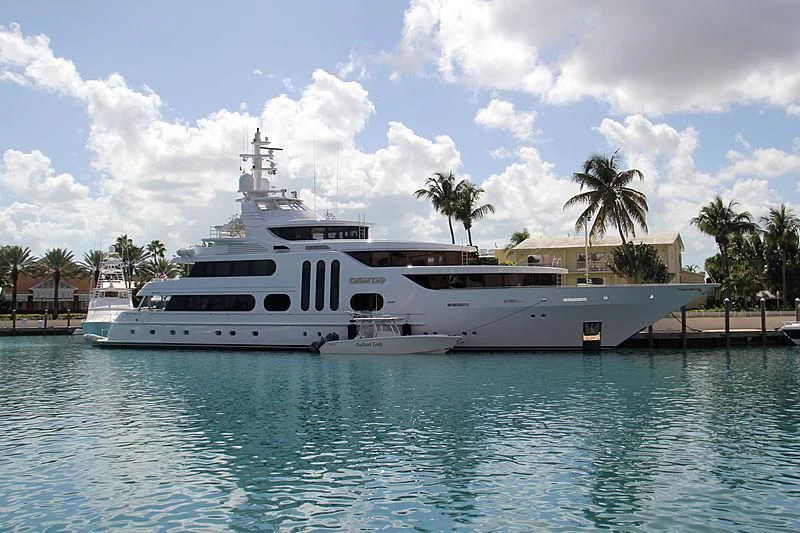 a large white boat in a body of water aboard ACTA Yacht for Charter