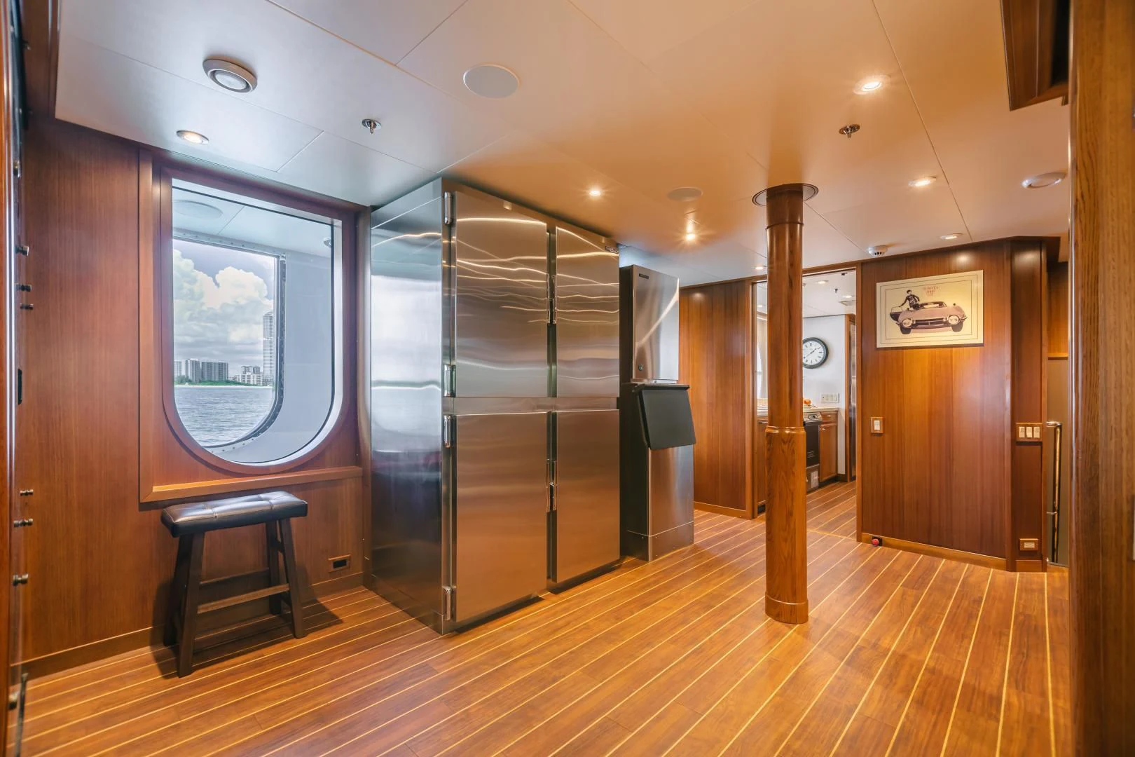 a room with a wood floor and a large glass door aboard ACTA Yacht for Charter