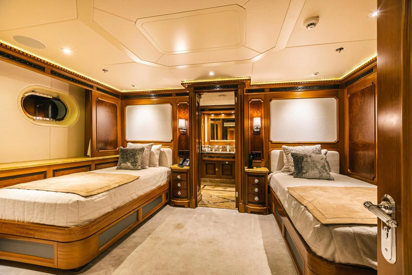a room with two beds aboard ACTA Yacht for Charter