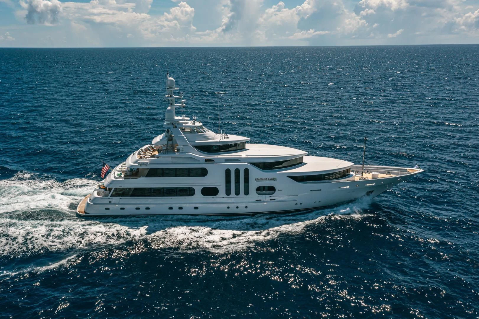 a white boat in the ocean aboard ACTA Yacht for Charter