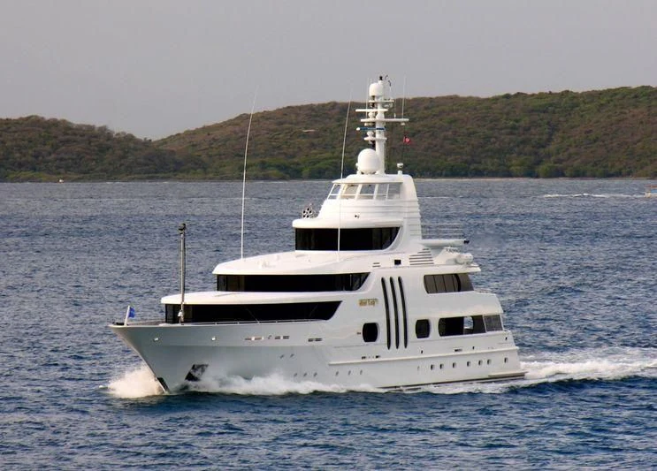 a white yacht on the water aboard ACTA Yacht for Charter