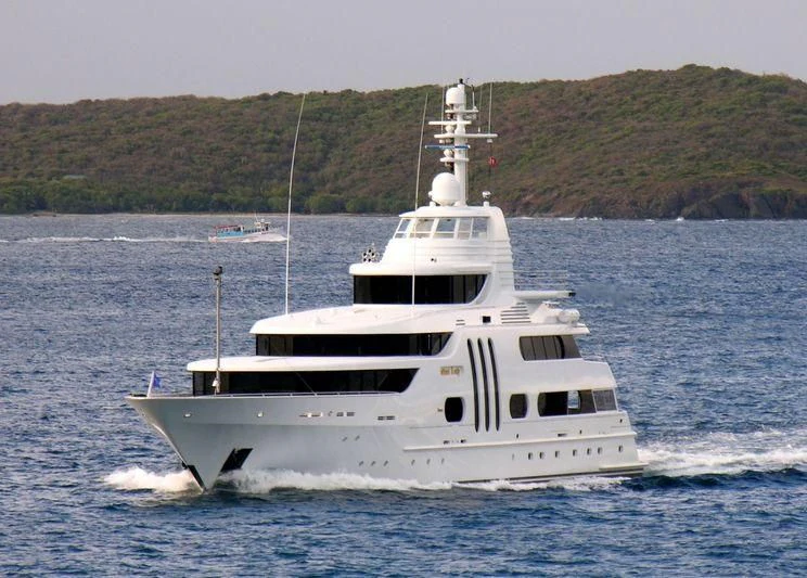 a white boat on the water aboard ACTA Yacht for Charter