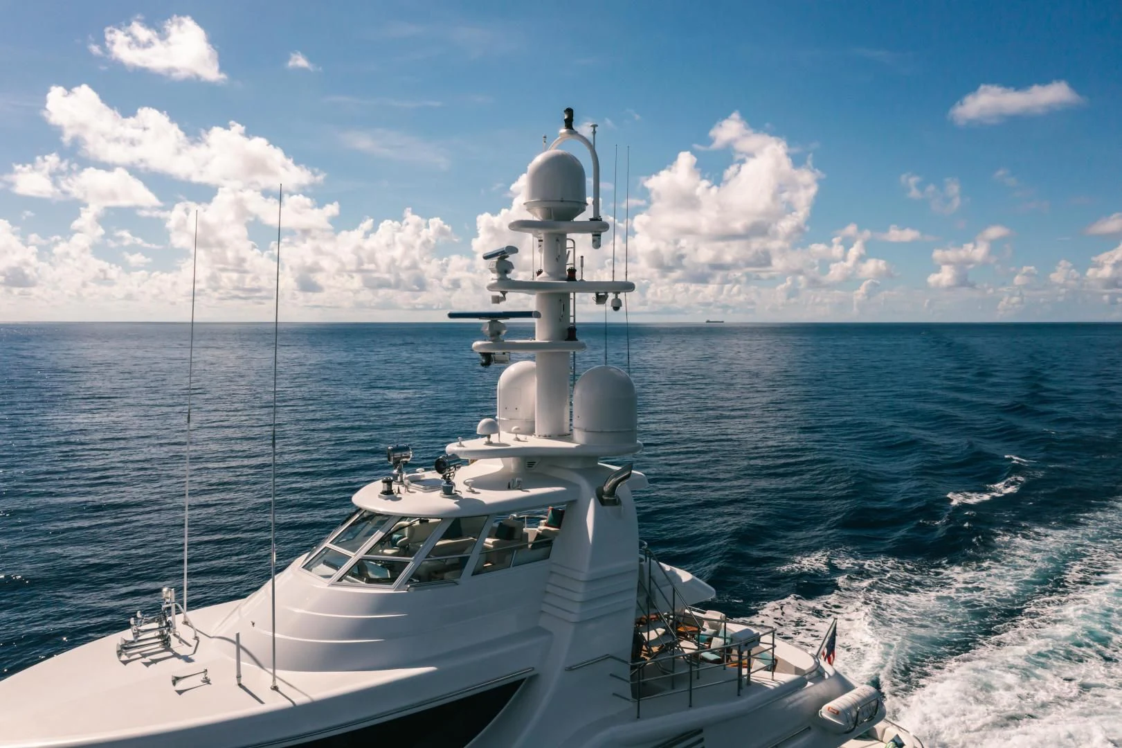 a white boat in the water aboard ACTA Yacht for Charter