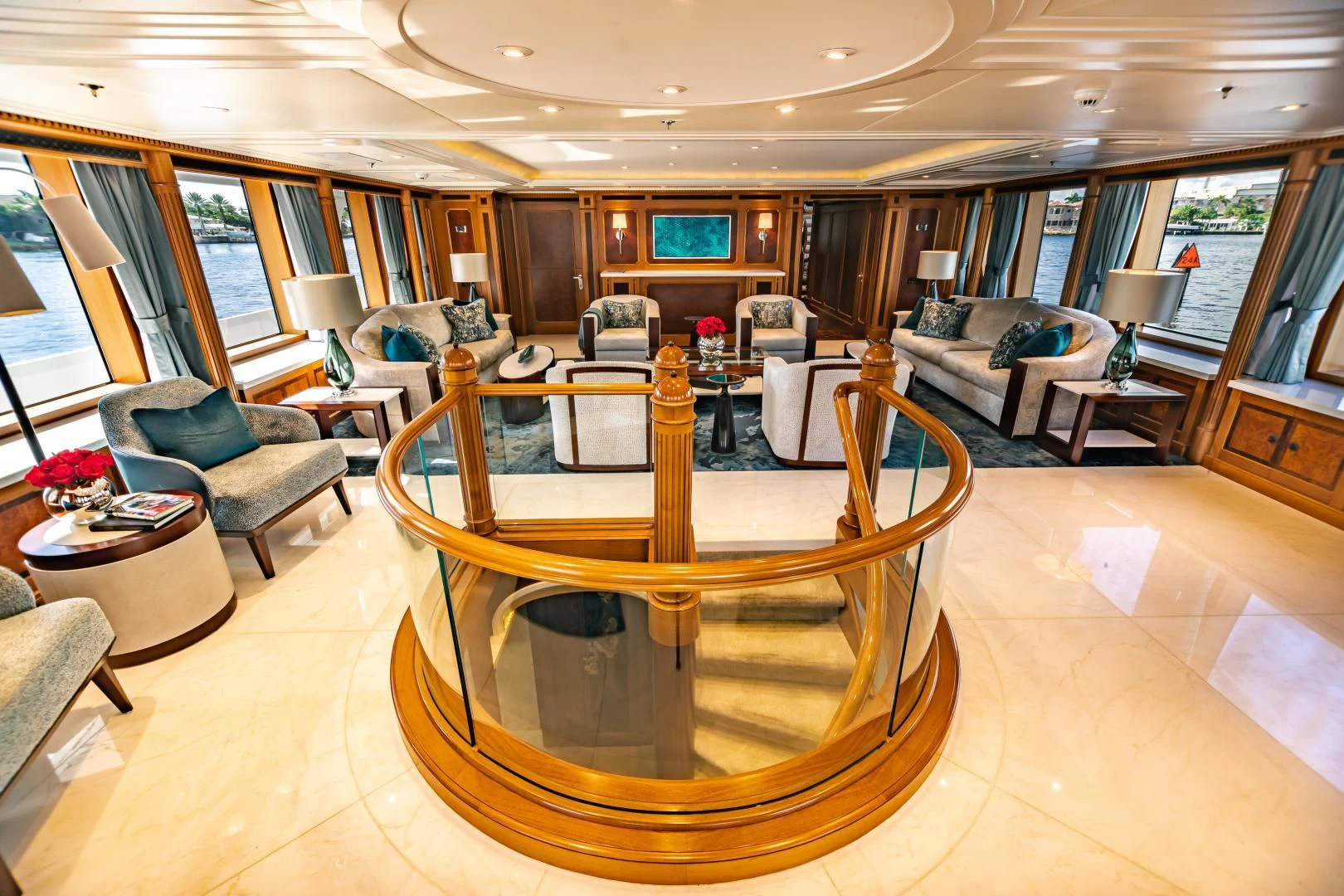 a large living room with a large wood table aboard ACTA Yacht for Charter
