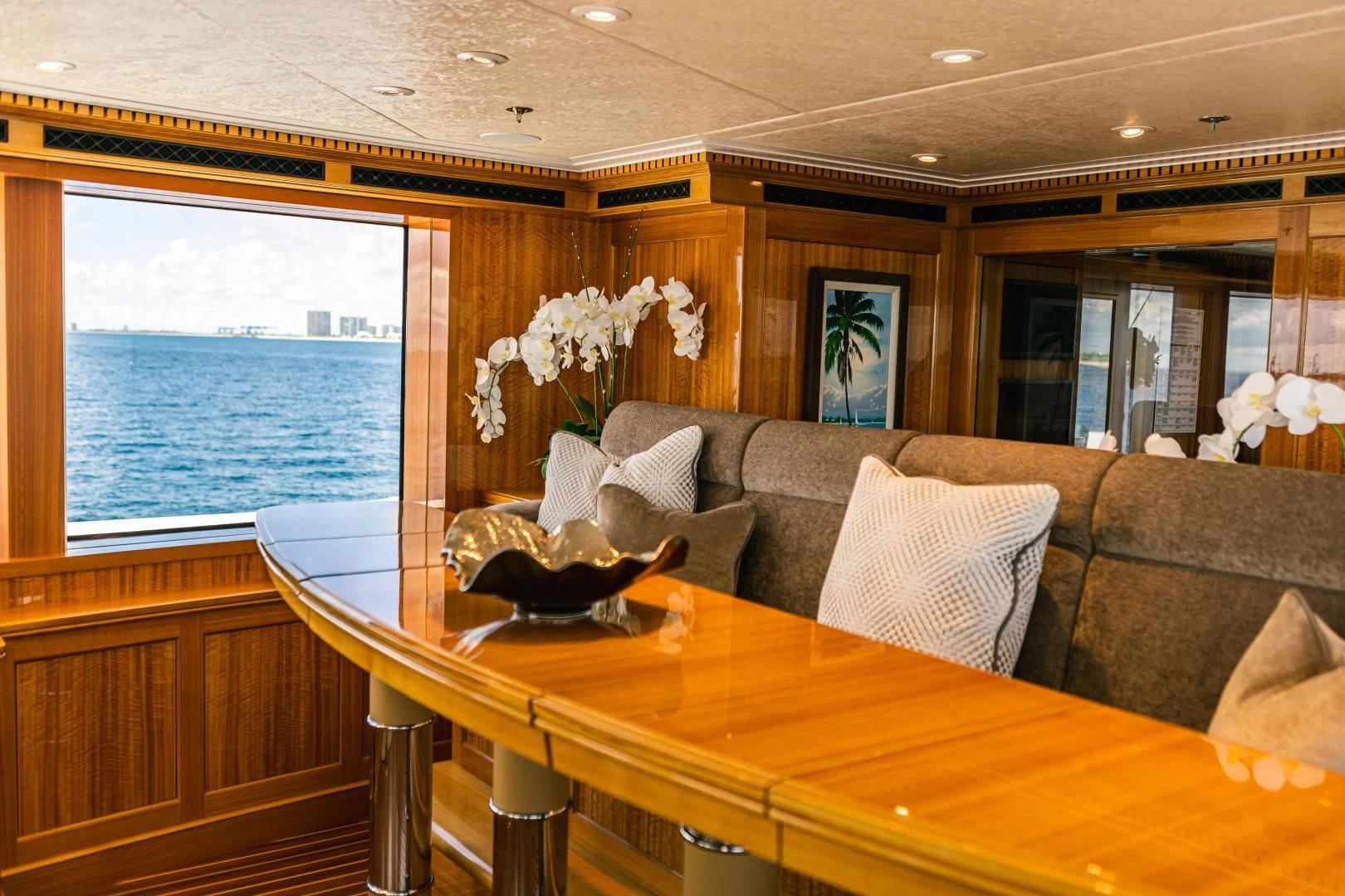 a living room with a couch and a table aboard ACTA Yacht for Charter
