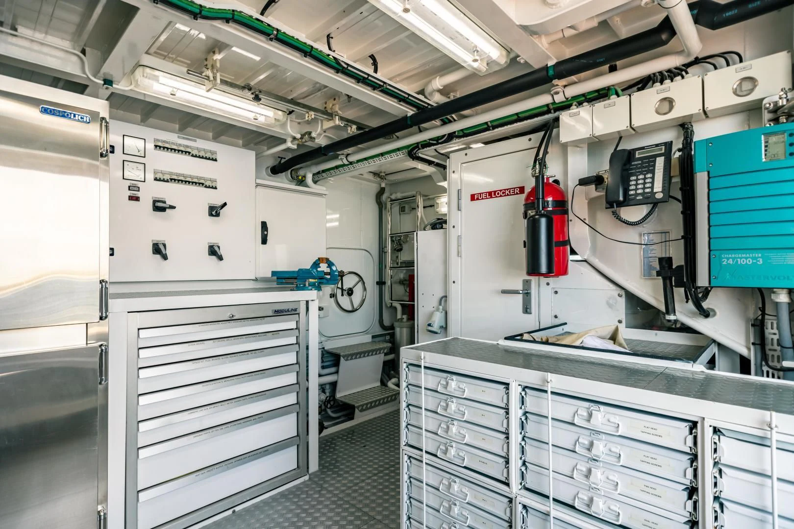 a room with machines and equipment aboard ACTA Yacht for Charter