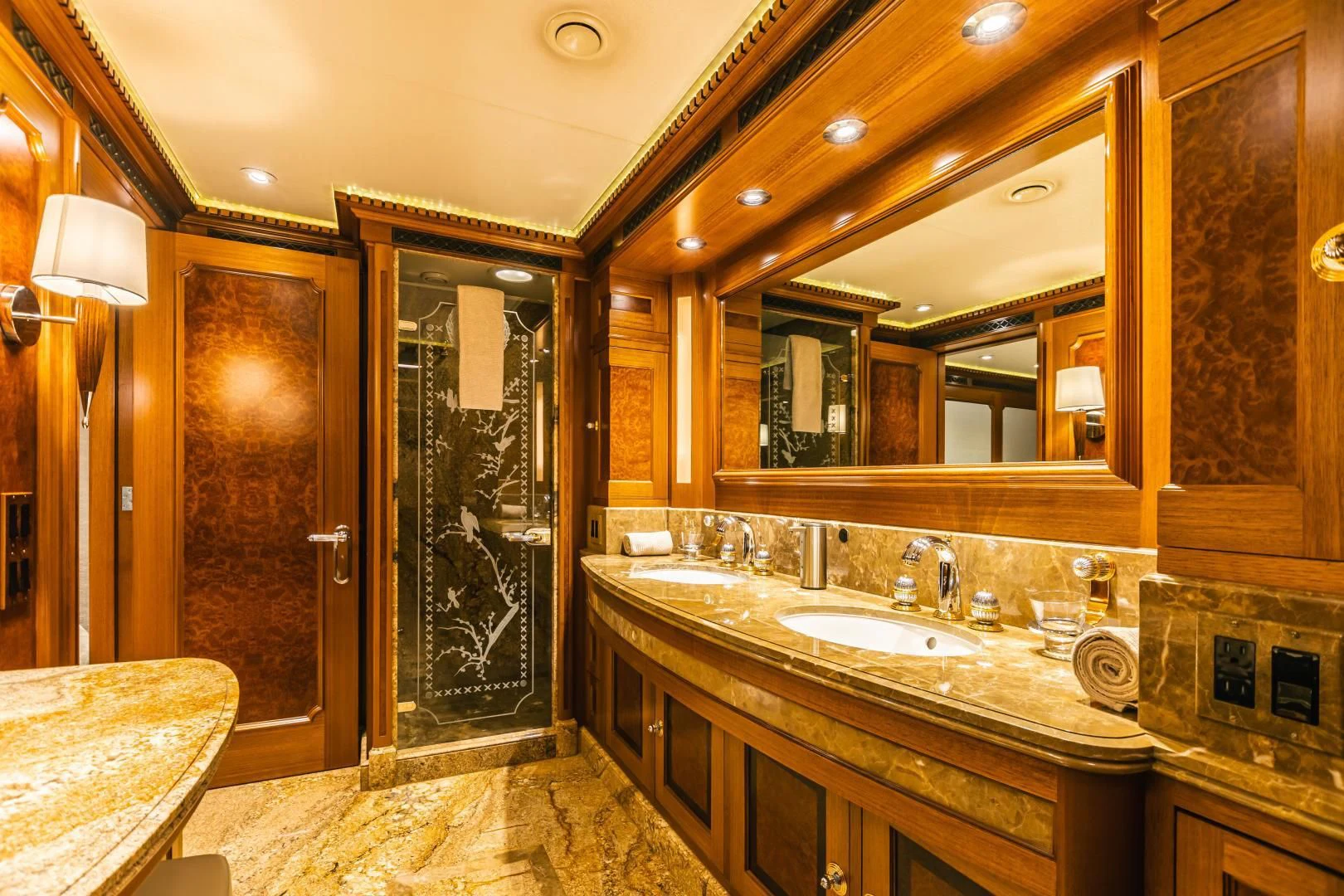 a bathroom with double sinks aboard ACTA Yacht for Charter