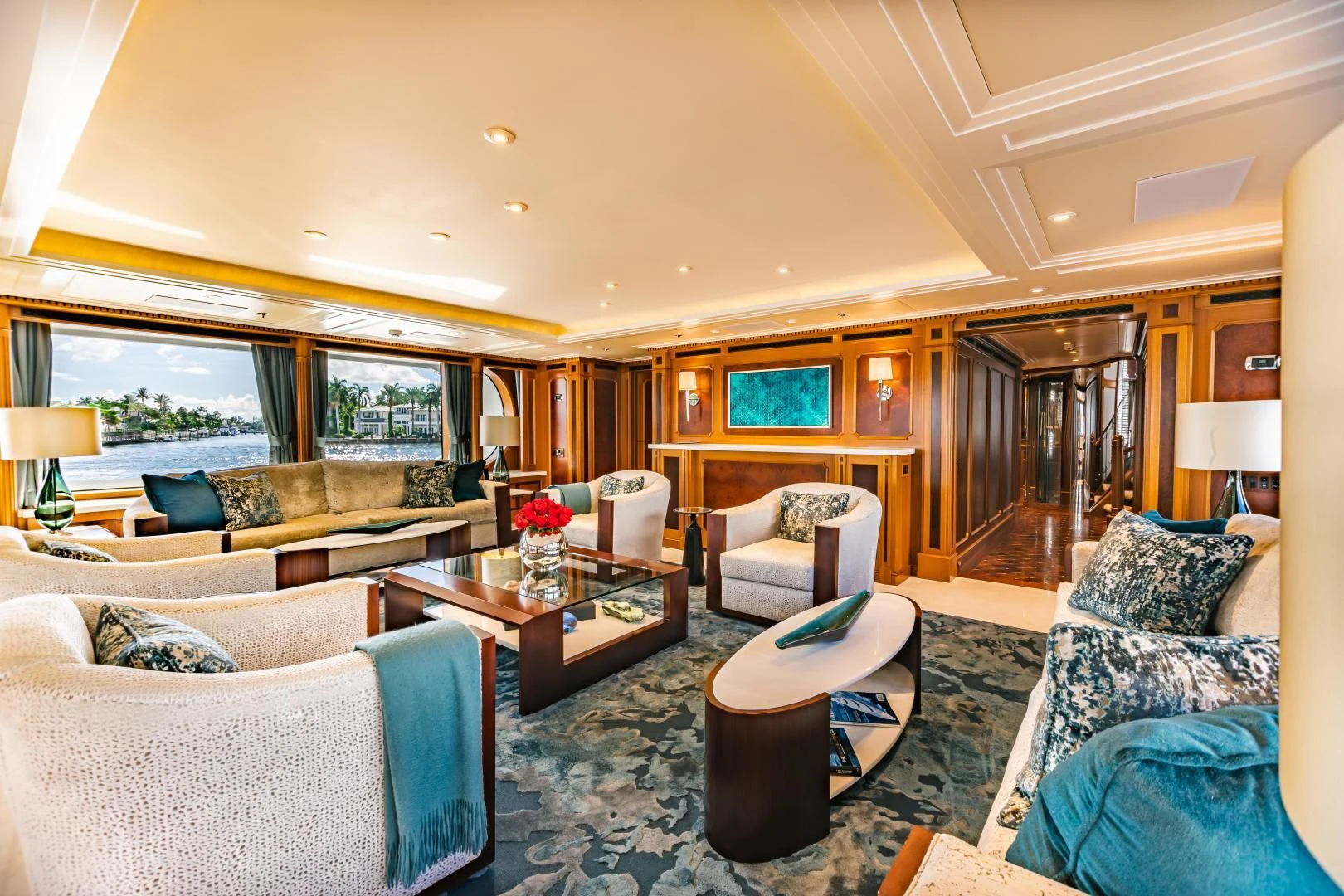a living room with a large window aboard ACTA Yacht for Charter