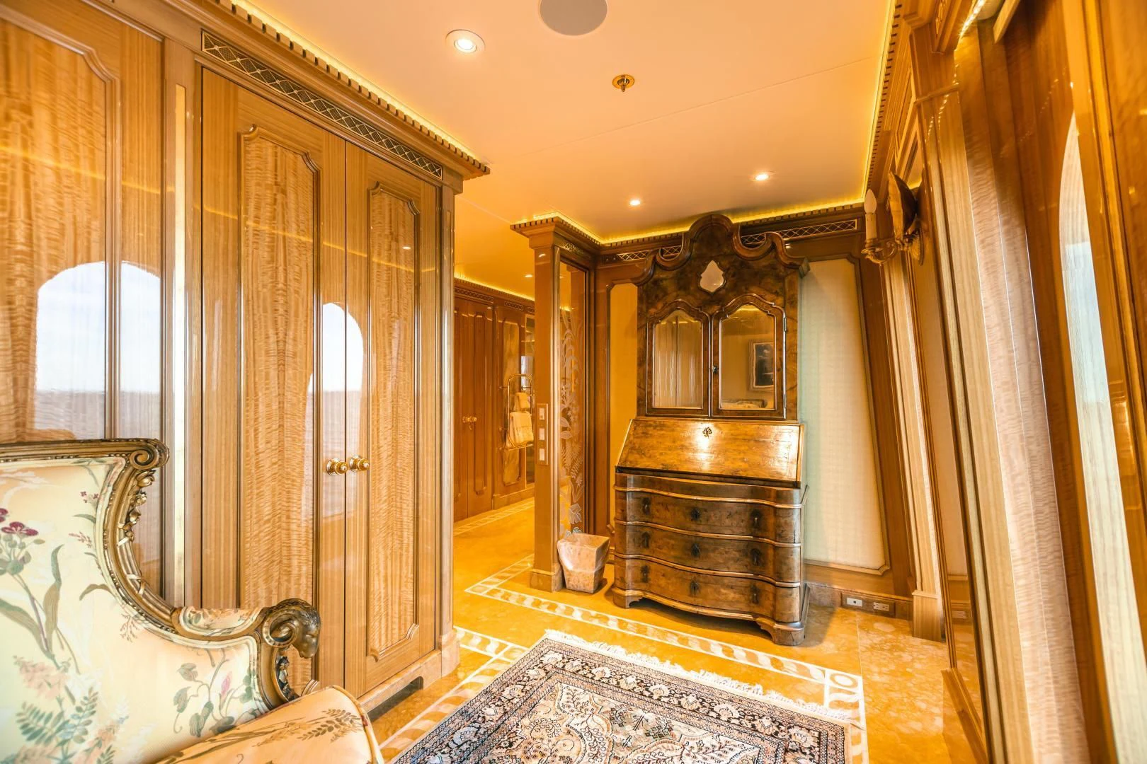 a fancy living room with a fireplace aboard ACTA Yacht for Charter