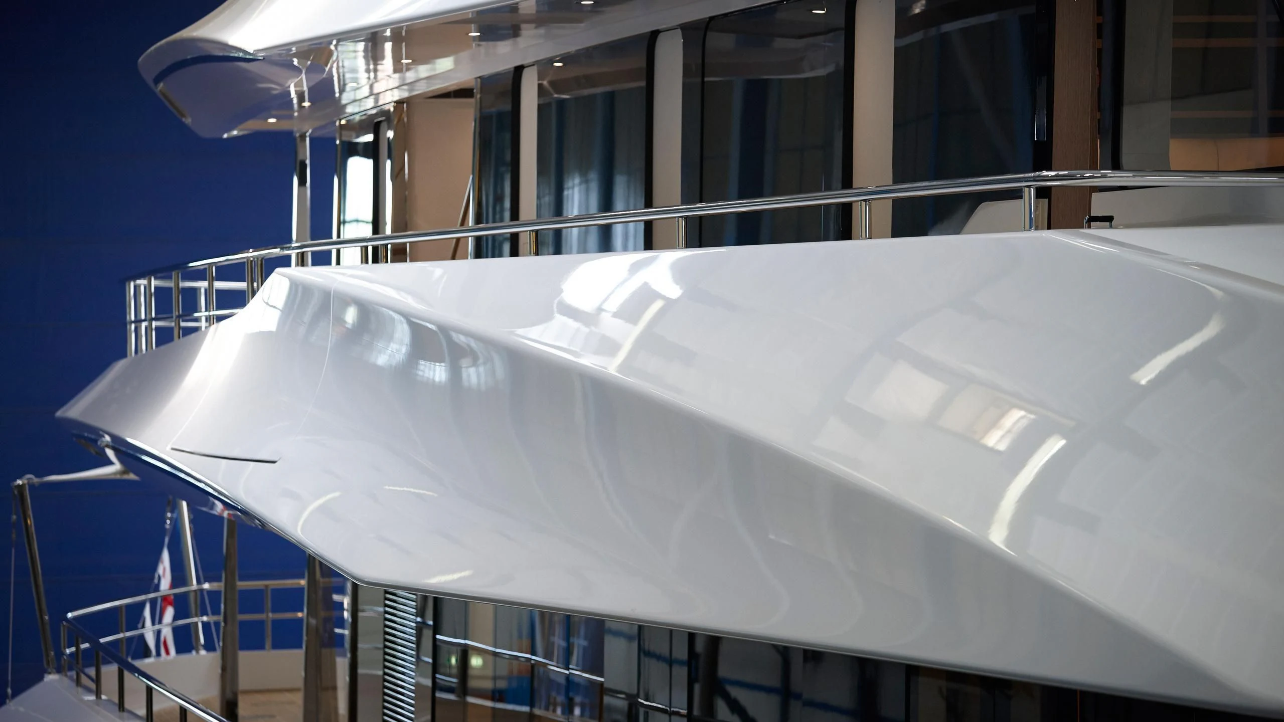 a white boat on a deck aboard JOY Yacht for Sale