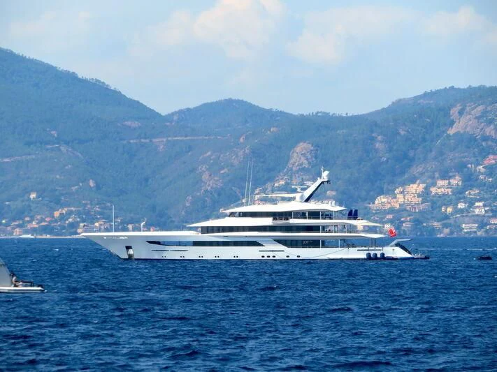 a large white boat in the water aboard JOY Yacht for Sale