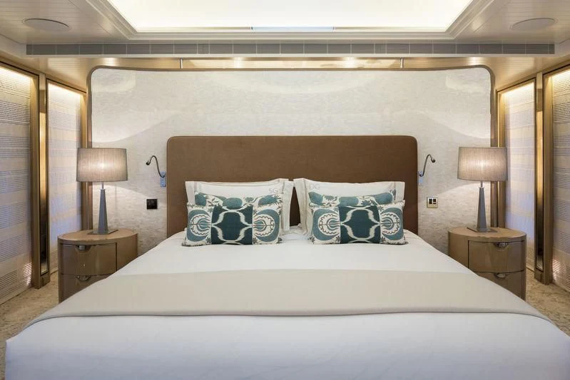 a bed with a pillow and pillows aboard JOY Yacht for Sale