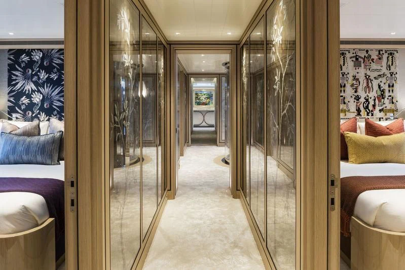 a room with a glass wall aboard JOY Yacht for Sale