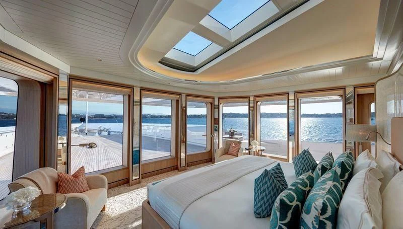 a large living room with a large balcony aboard JOY Yacht for Sale