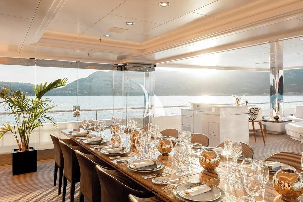 a table set for a dinner aboard JOY Yacht for Sale