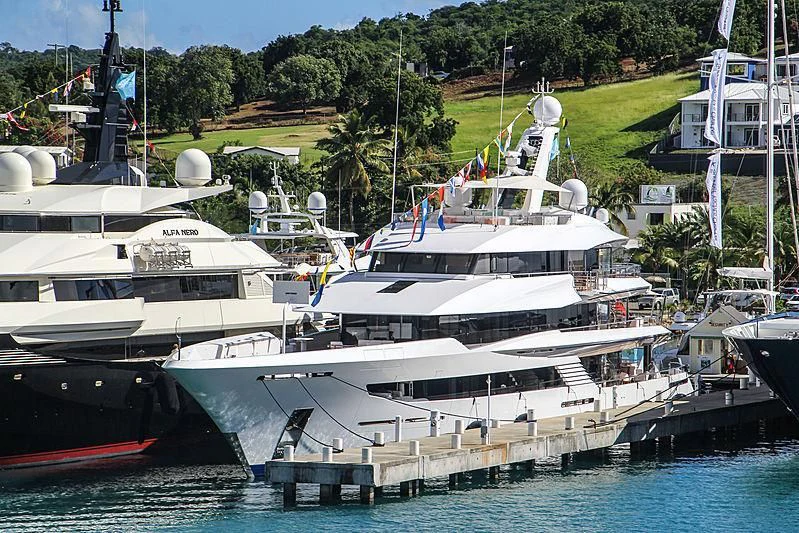 several boats docked at a pier aboard JOY Yacht for Sale