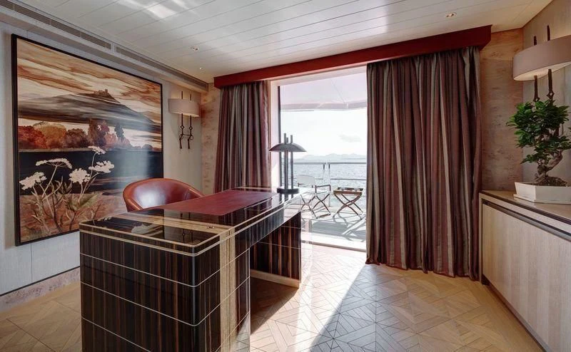 a room with a bed and a window aboard JOY Yacht for Sale