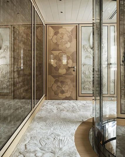 a room with a large mirror aboard JOY Yacht for Sale