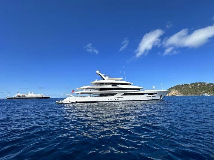 a white boat in the water aboard JOY Yacht for Sale