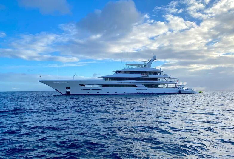 a large white boat in the water aboard JOY Yacht for Sale
