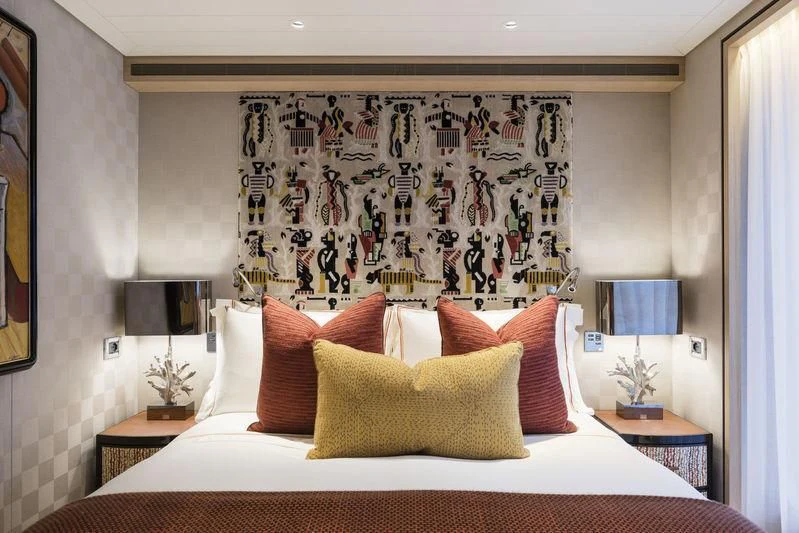 a bed with pillows aboard JOY Yacht for Sale