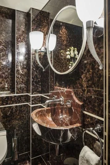 a bathroom with a mirror aboard JOY Yacht for Sale