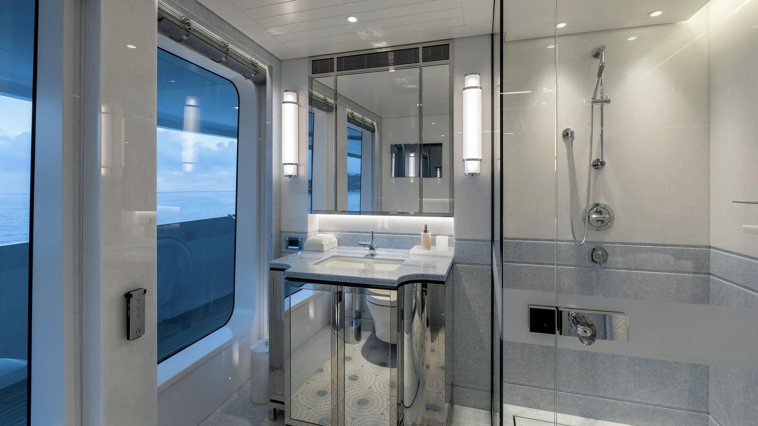 a bathroom with a sink and a mirror aboard JOY Yacht for Sale