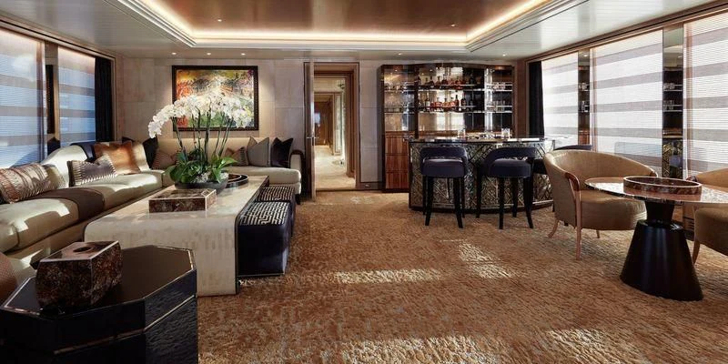 a living room with a couch and coffee table aboard JOY Yacht for Sale