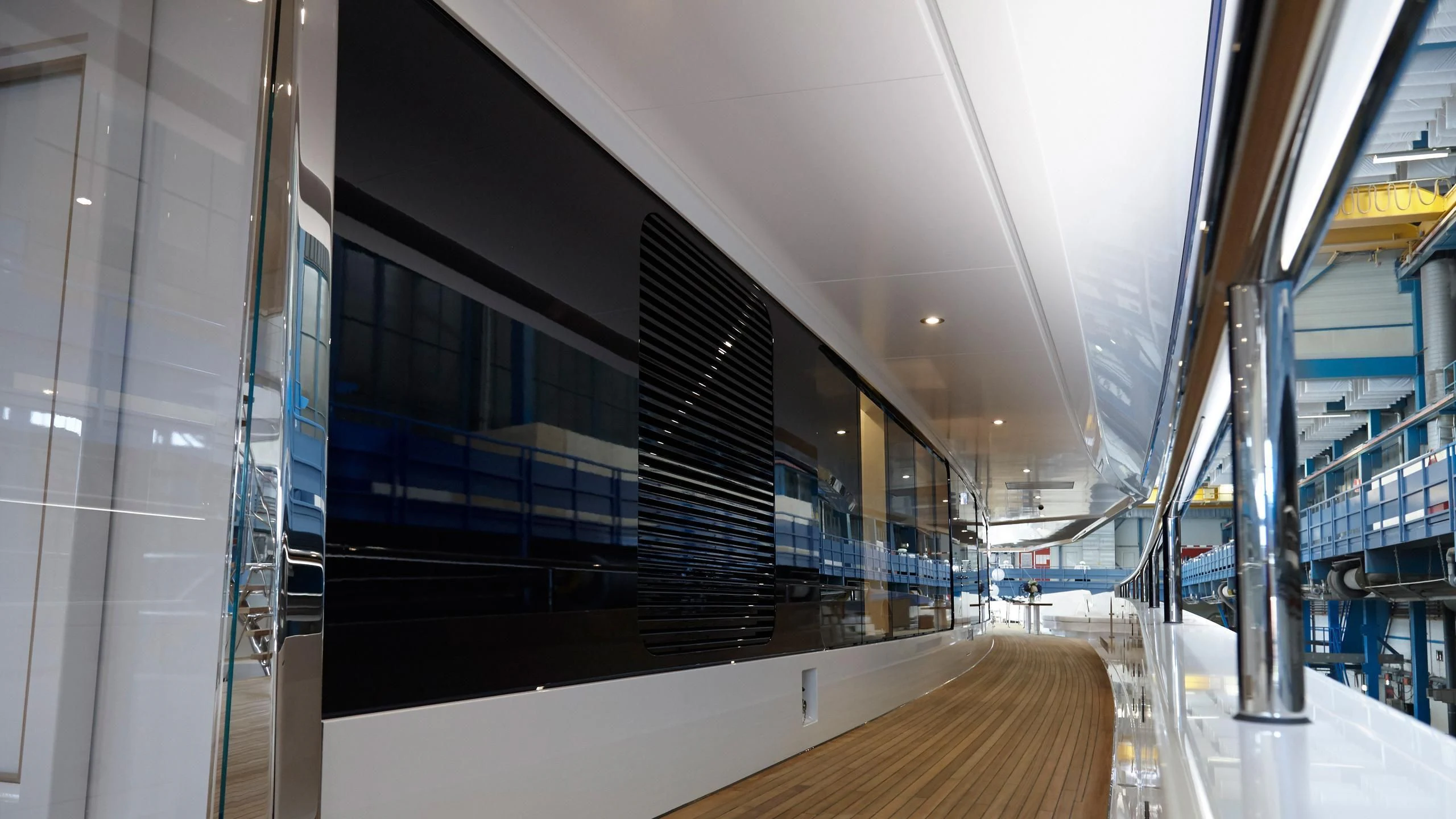 a large room with glass walls aboard JOY Yacht for Sale