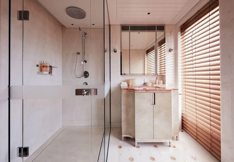 a bathroom with a shower unit and sink aboard JOY Yacht for Sale