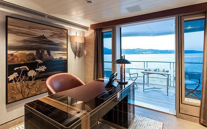a large bed in a room aboard JOY Yacht for Sale