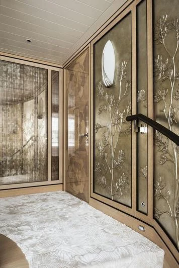 a large mirror in a room aboard JOY Yacht for Sale