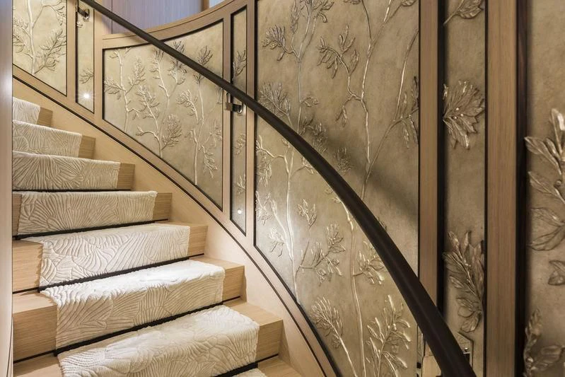 a bed with a wallpaper aboard JOY Yacht for Sale