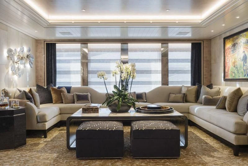 a living room with a large window aboard JOY Yacht for Sale