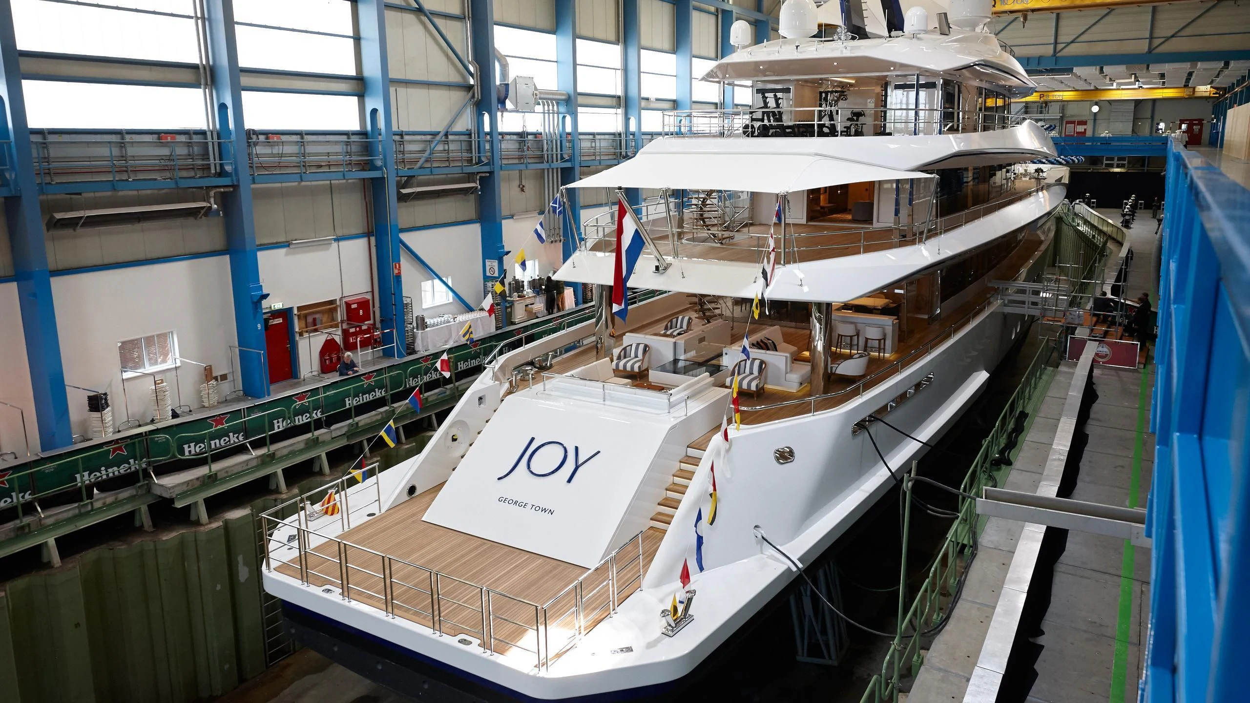 a large ship in a large building aboard JOY Yacht for Sale