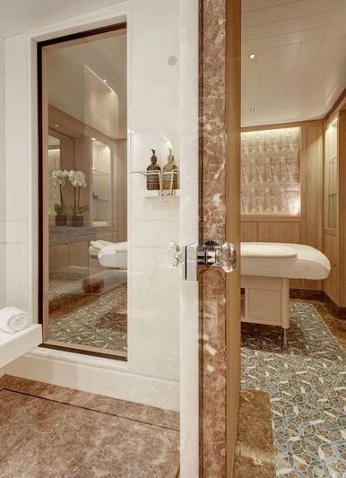 a bathroom with a glass shower aboard JOY Yacht for Sale