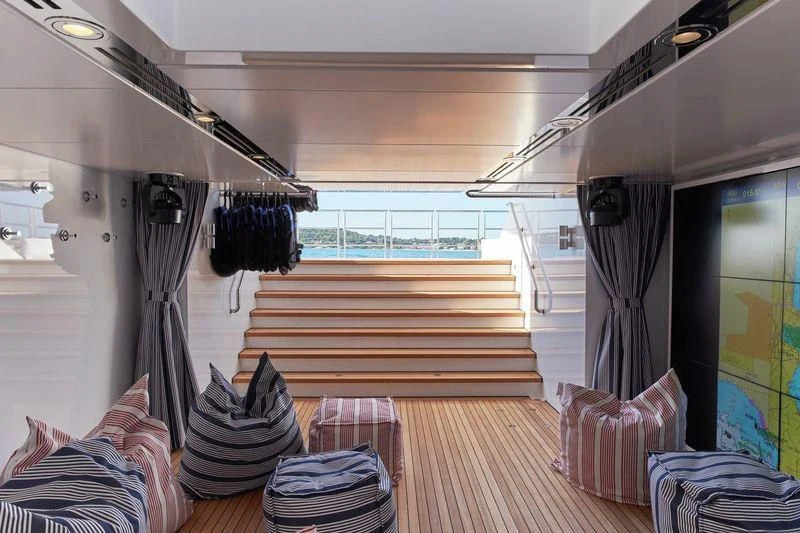 a room with a bed and a table aboard JOY Yacht for Sale