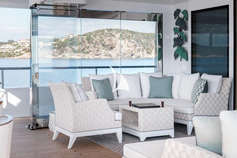 a living room with a large window aboard JOY Yacht for Sale