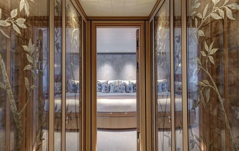 a room with a glass door aboard JOY Yacht for Sale