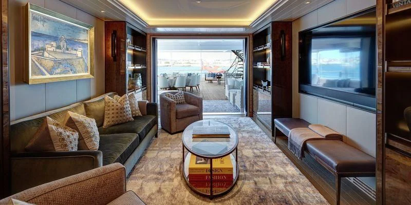 a living room with a large window aboard JOY Yacht for Sale