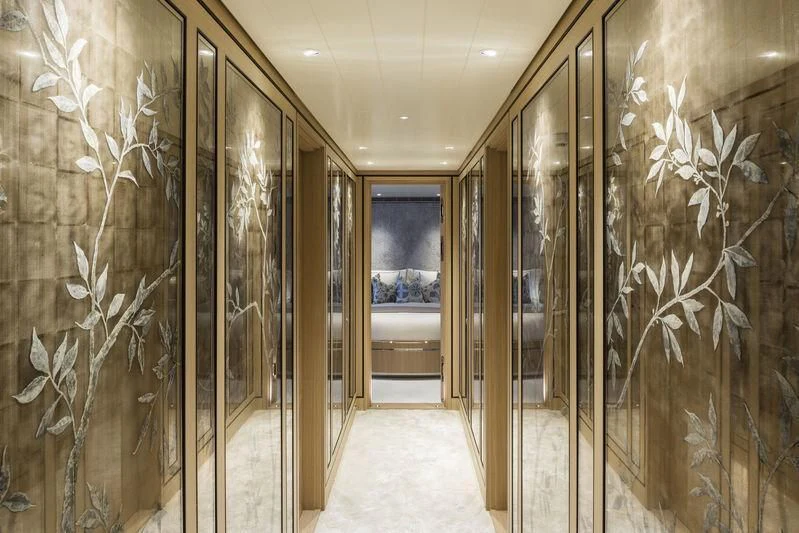 a hallway with glass walls aboard JOY Yacht for Sale