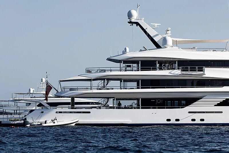 a large white boat in the water aboard JOY Yacht for Sale