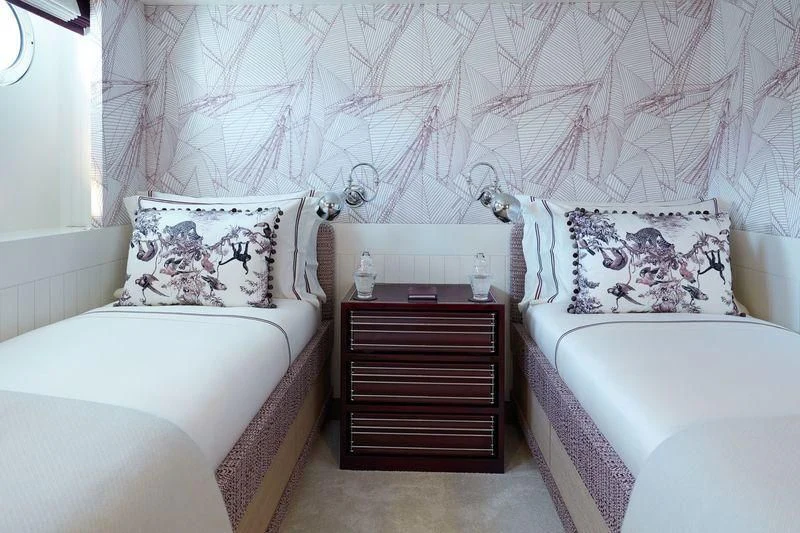 a couple of beds in a room aboard JOY Yacht for Sale