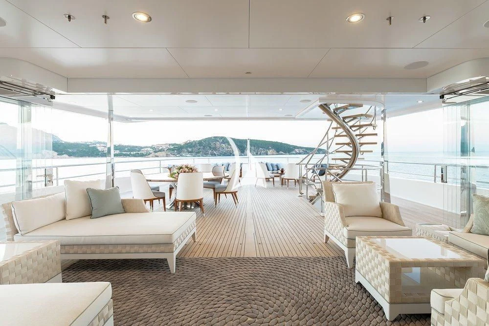 a living room with a large window aboard JOY Yacht for Sale