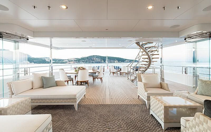 a living room with a large window aboard JOY Yacht for Sale