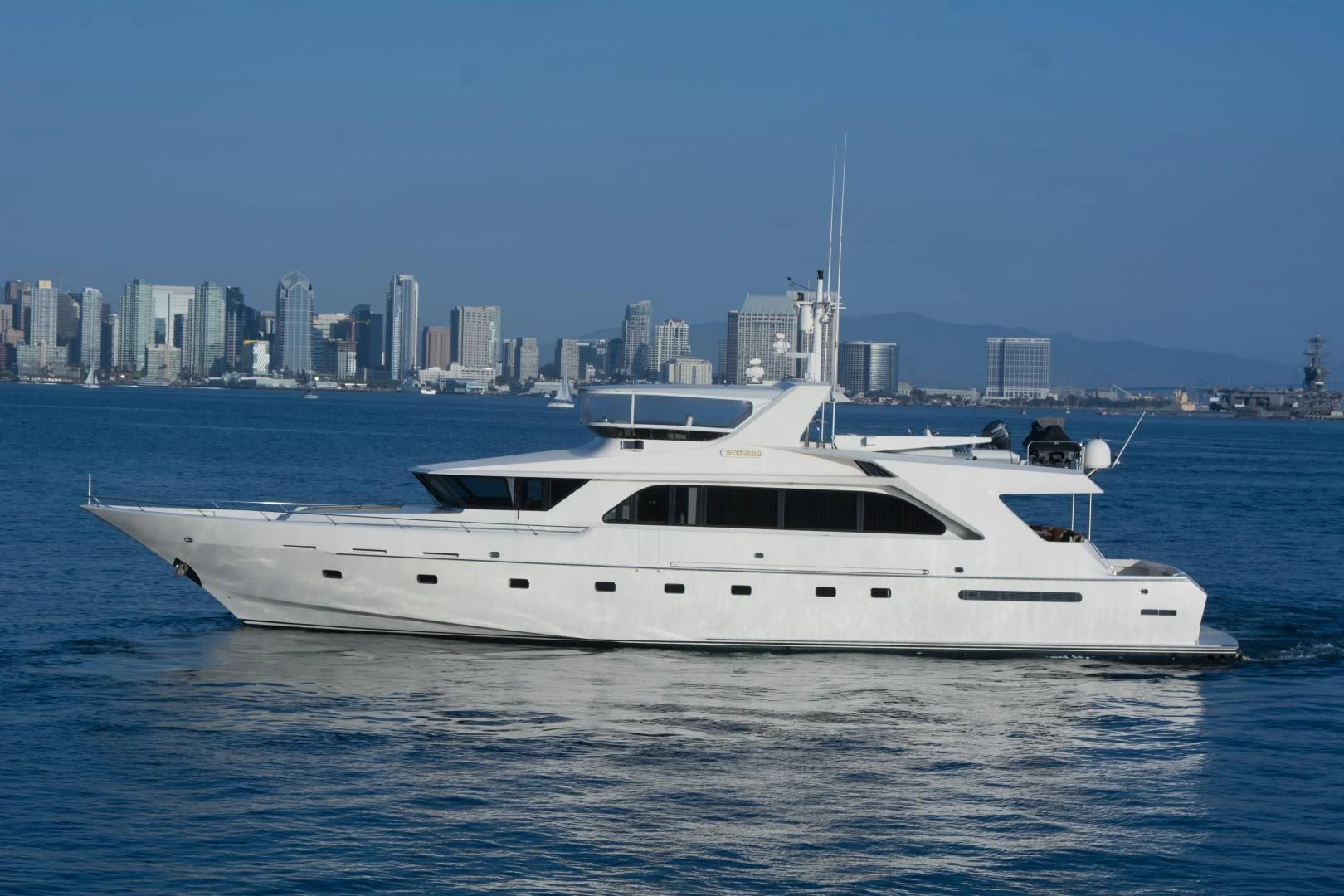 a white yacht in the water aboard WHISKEY DAWN Yacht for Sale