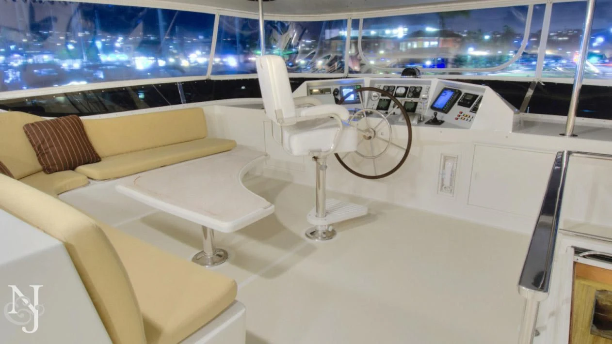 a white chair on a table aboard WHISKEY DAWN Yacht for Sale